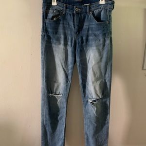 Straight cut jeans with knee cut outs